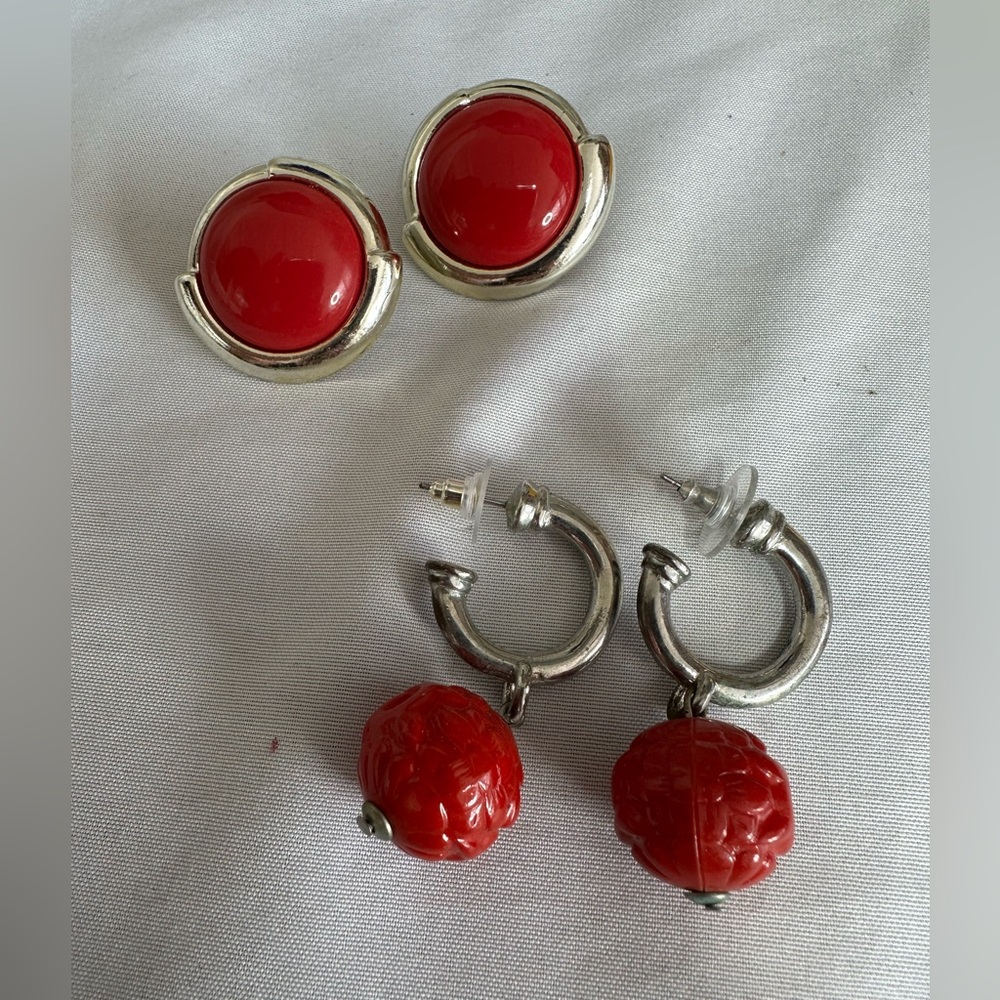 Two pair of older style red vibe earrings